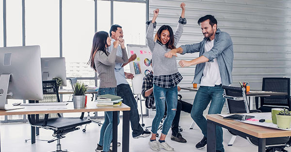 Peope dancing at an office party