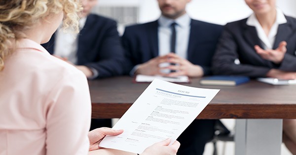 Woman holding resume in an interview