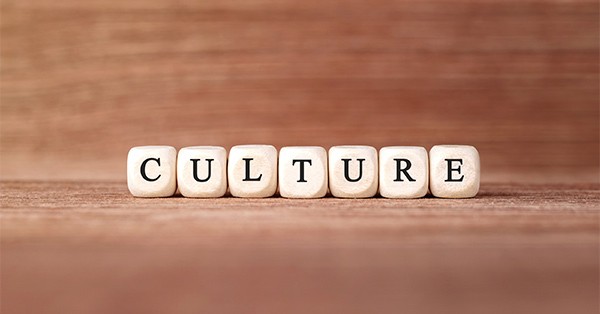 The words Culture in dice sitting on table