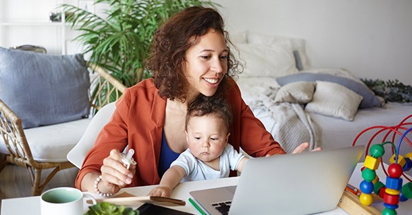 Mom working from home with baby on lap